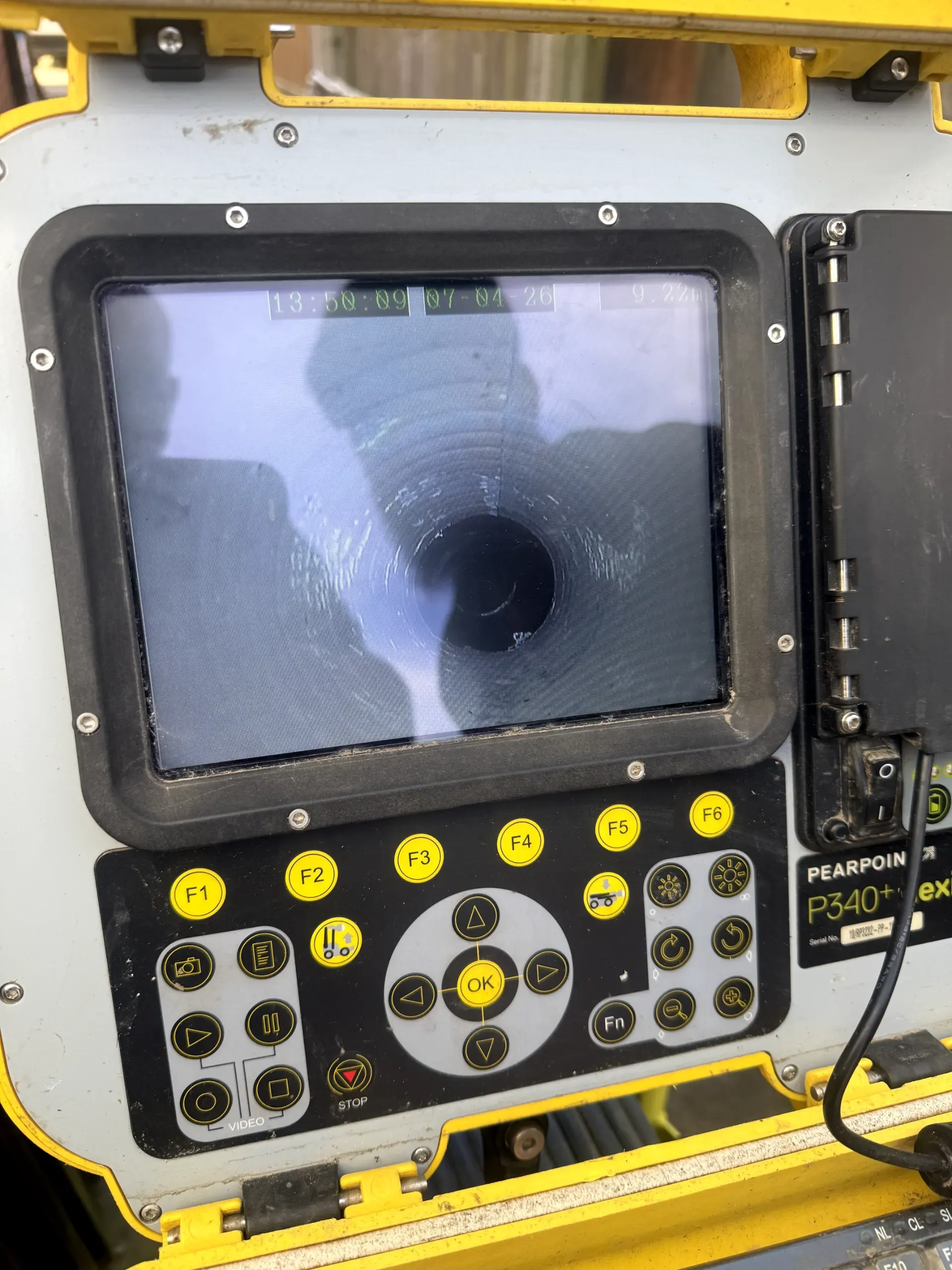 A CCTV drain survey monitor showing a live pipe inspection for a client in Darwen.