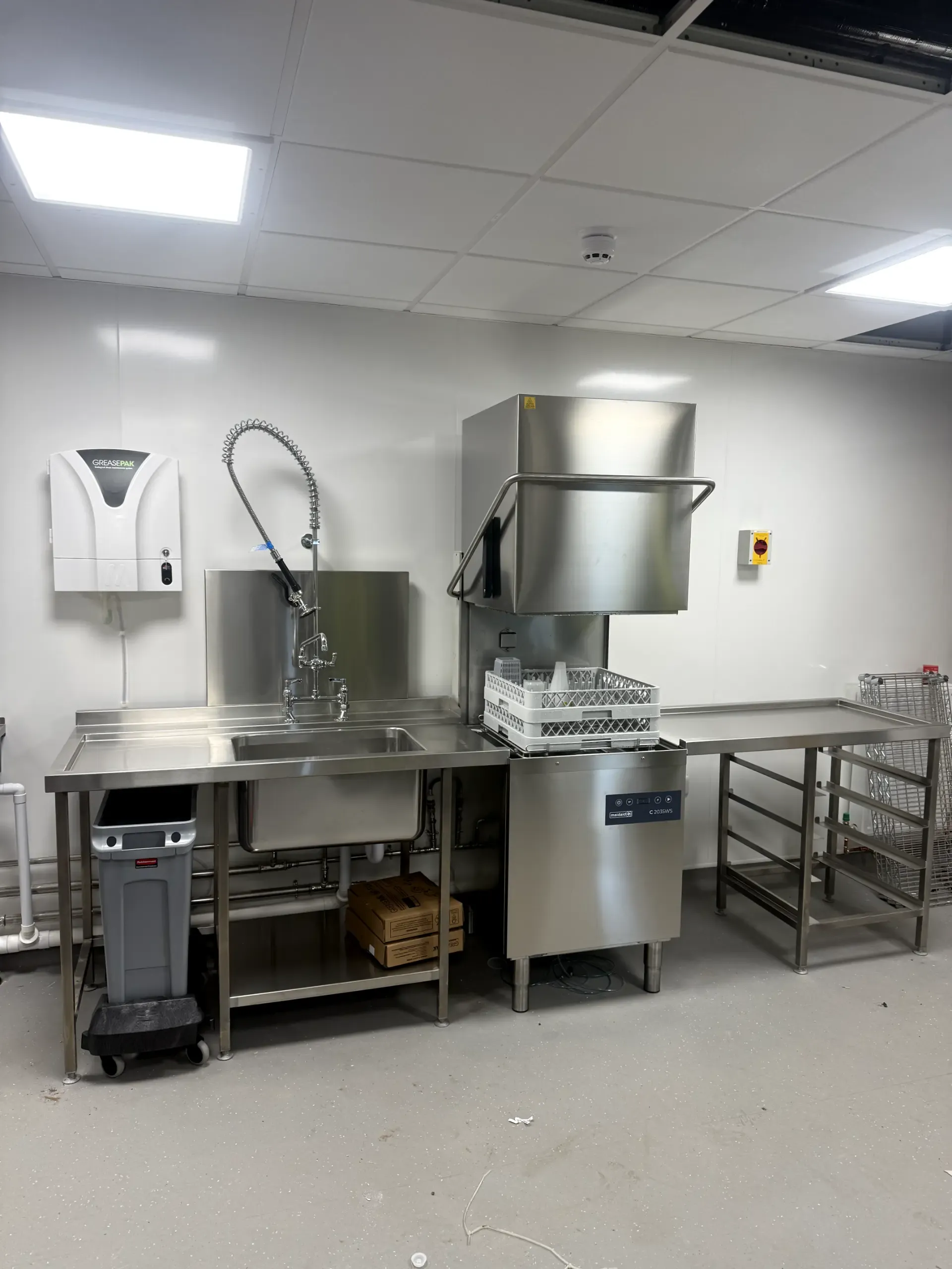 Commercial catering kitchen equipment installation including dishwasher and drainage systems in a Lancashire business.
