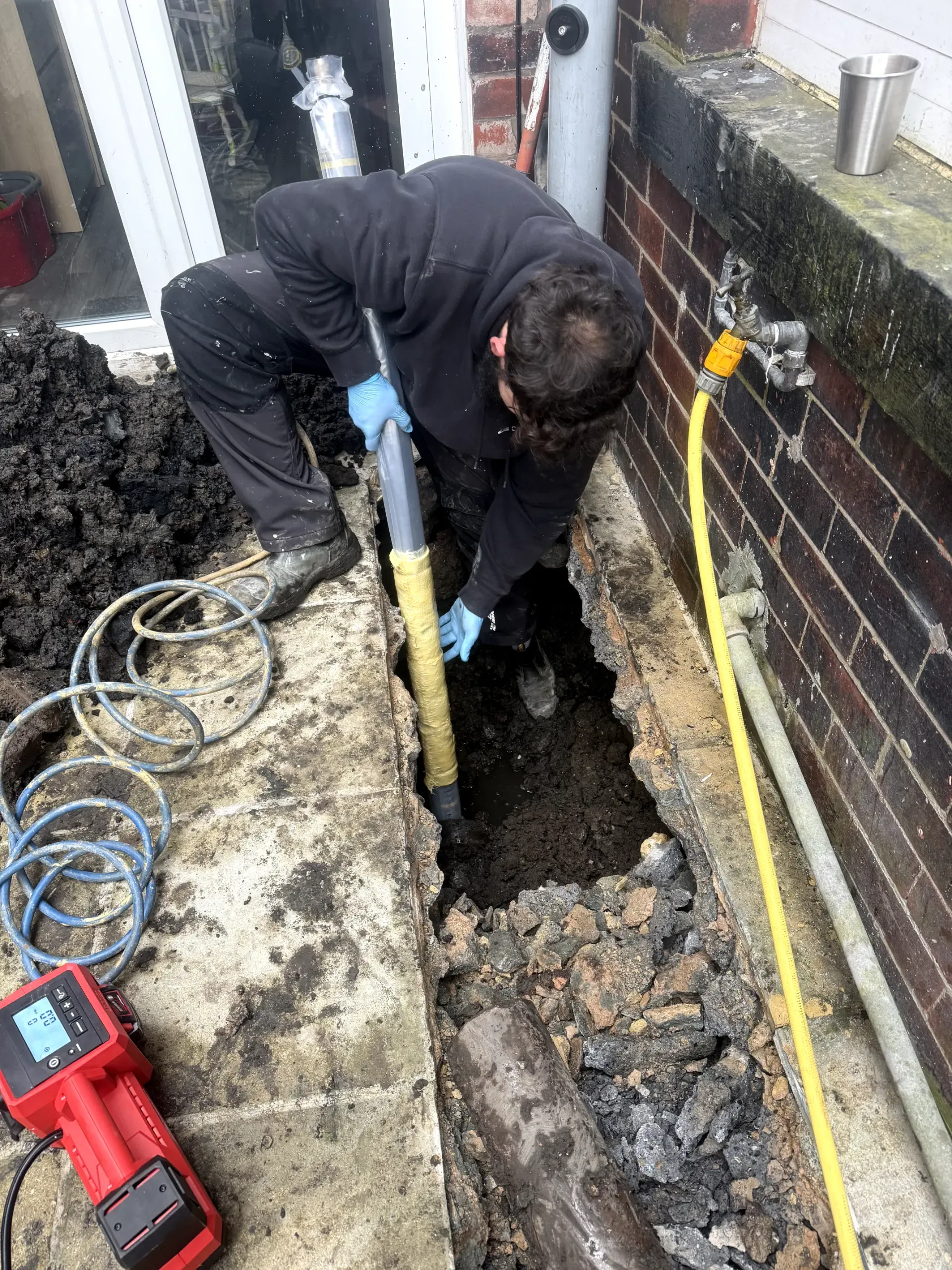 WGS Services engineer performing no-dig drain repairs and pipe lining in Darwen